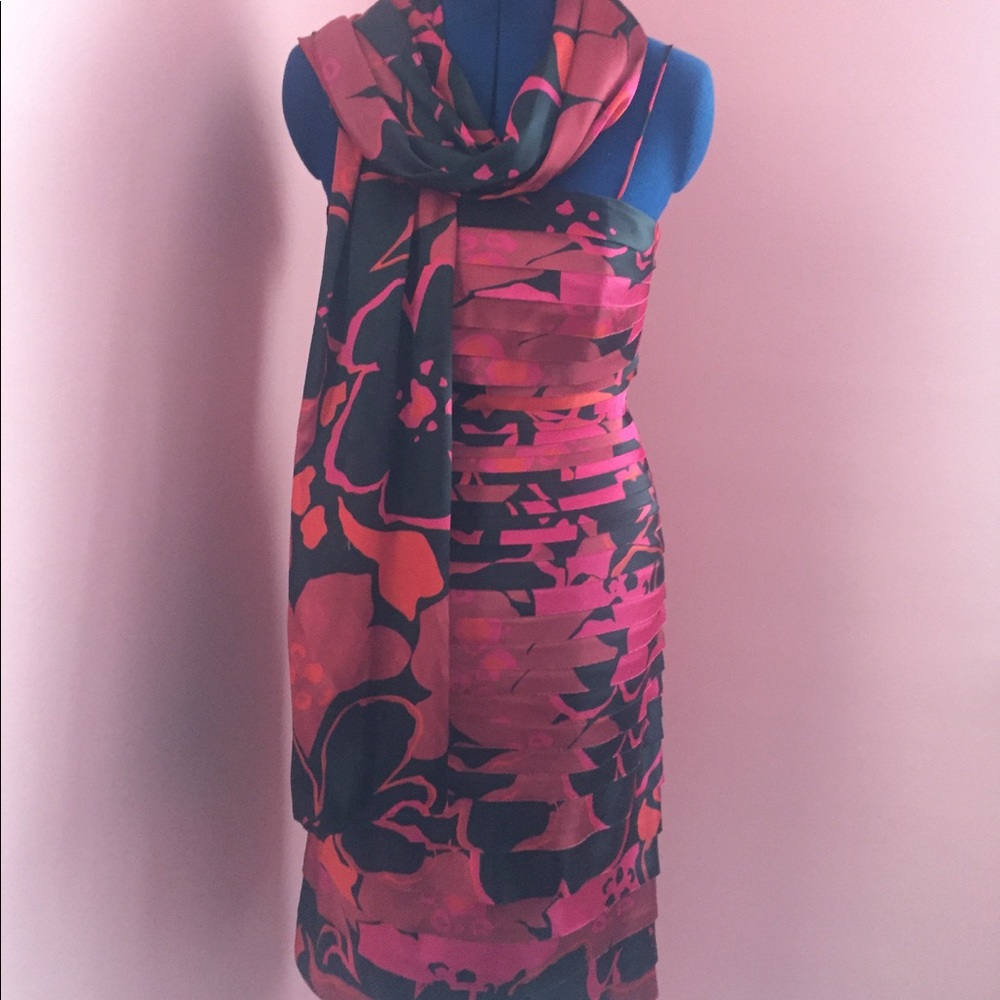 Print cocktail dress with matching scarf.